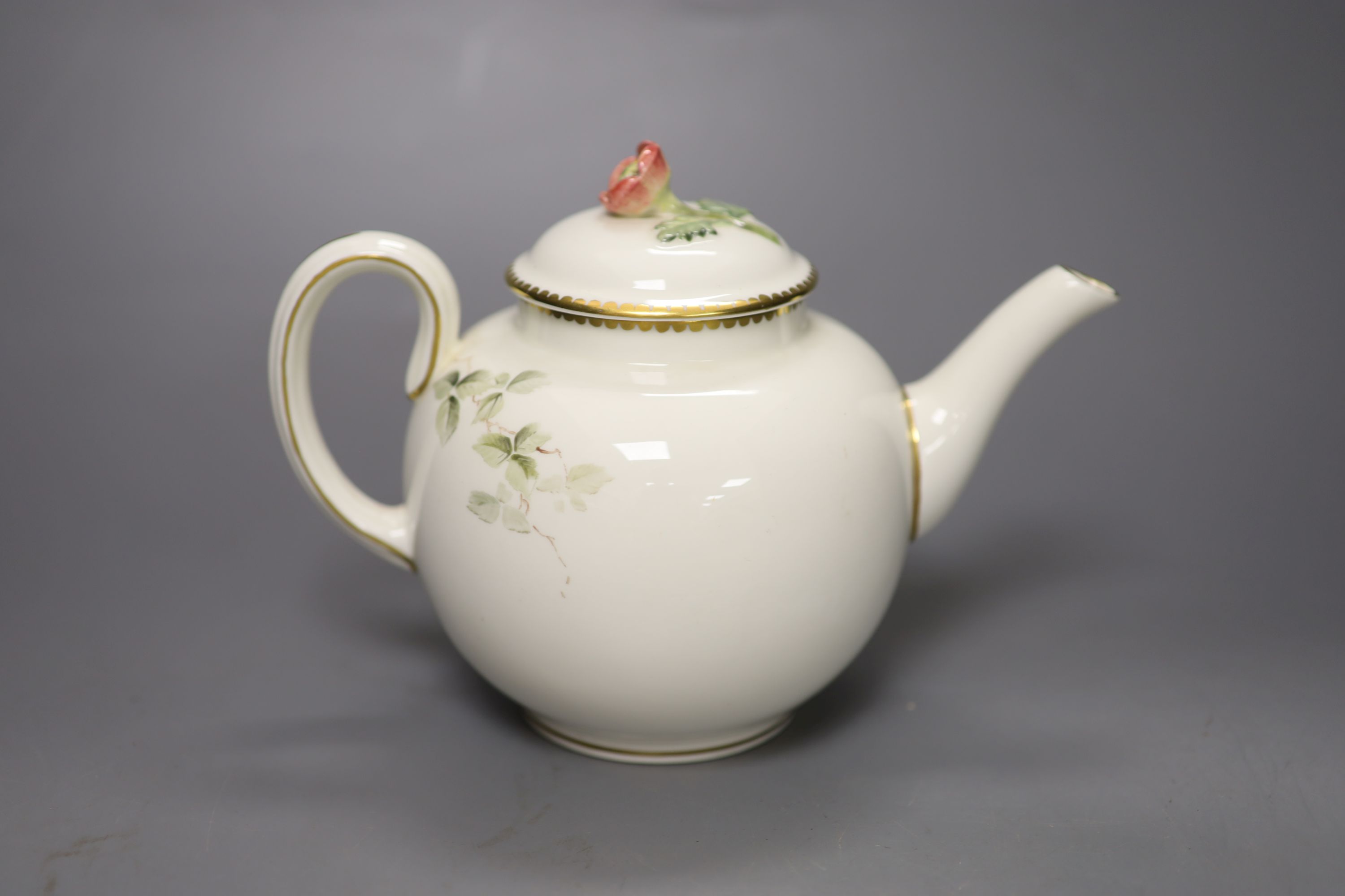 A Royal Worcester teapot and cover, painted with a Robin on a branch by E. Townsend, signed, black mark, height 15cm